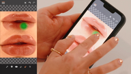 A hand with manicured nails interacts with a smartphone displaying edited lips.