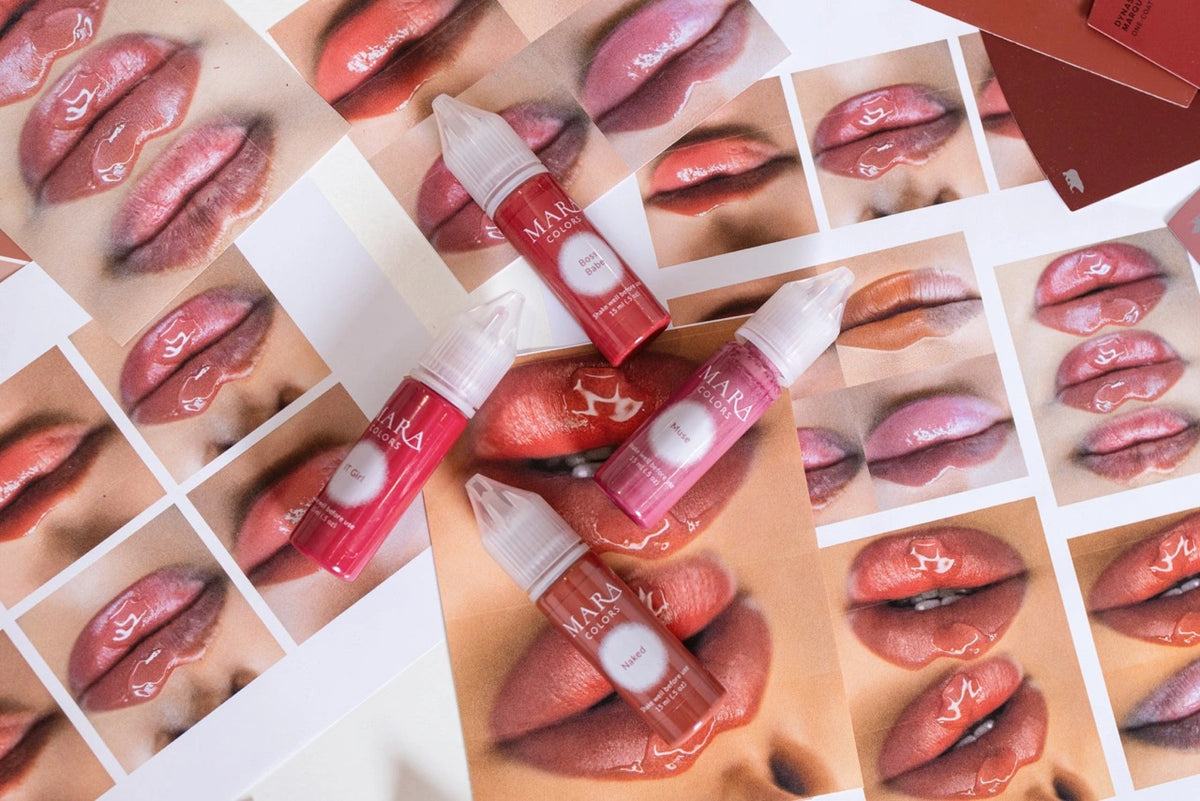 Pigment bottles on a sheet of lip swatch photos